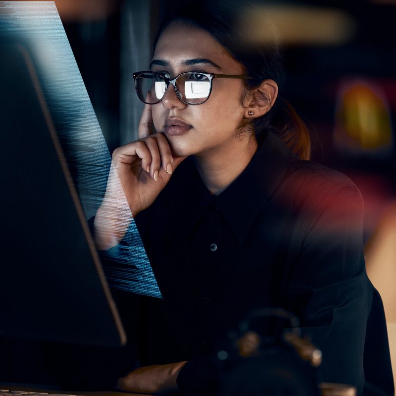 programming-cybersecurity-and-thinking-with-woman-at-computer-for-software-idea-and-coding-at-nig.jpg
